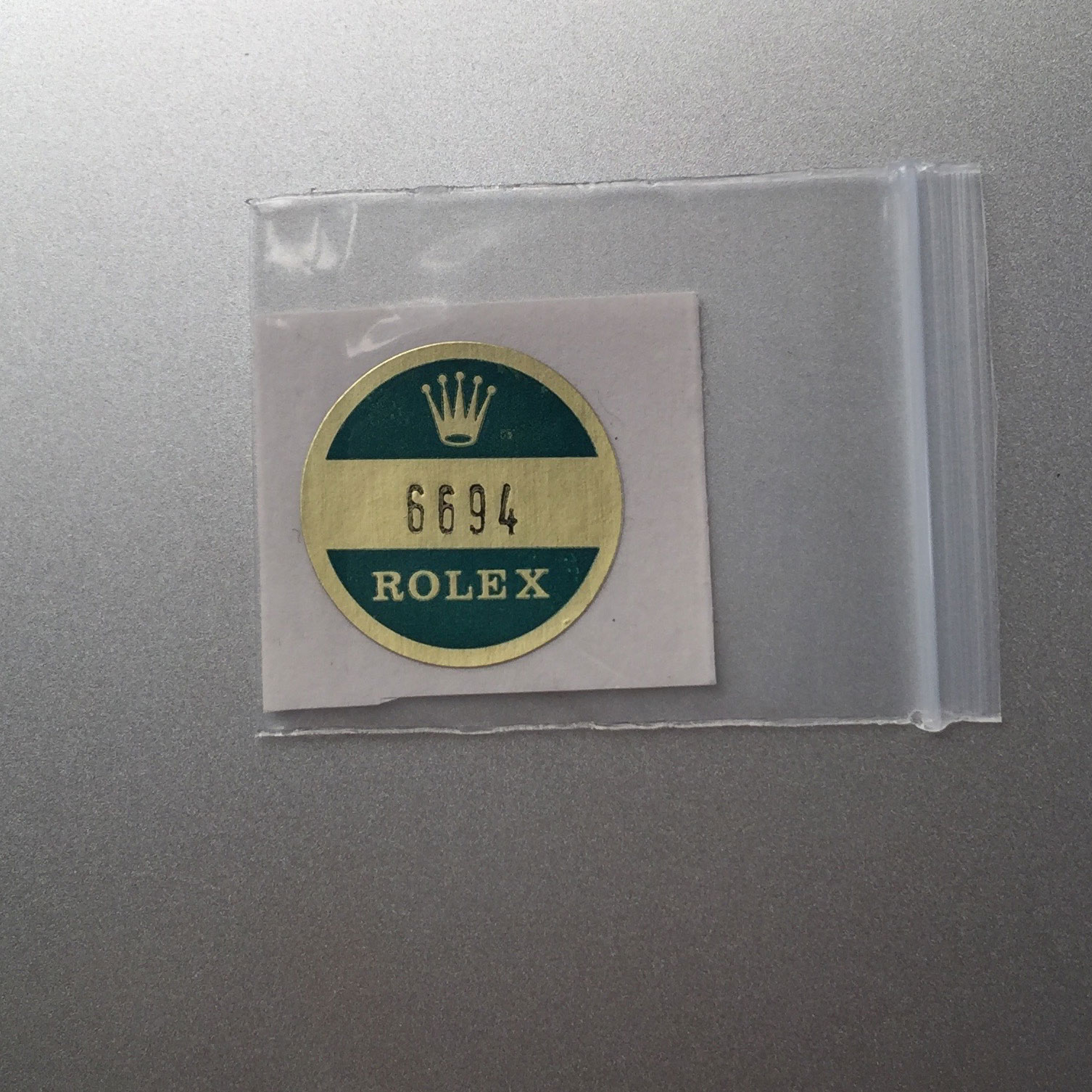 sticker on back of rolex